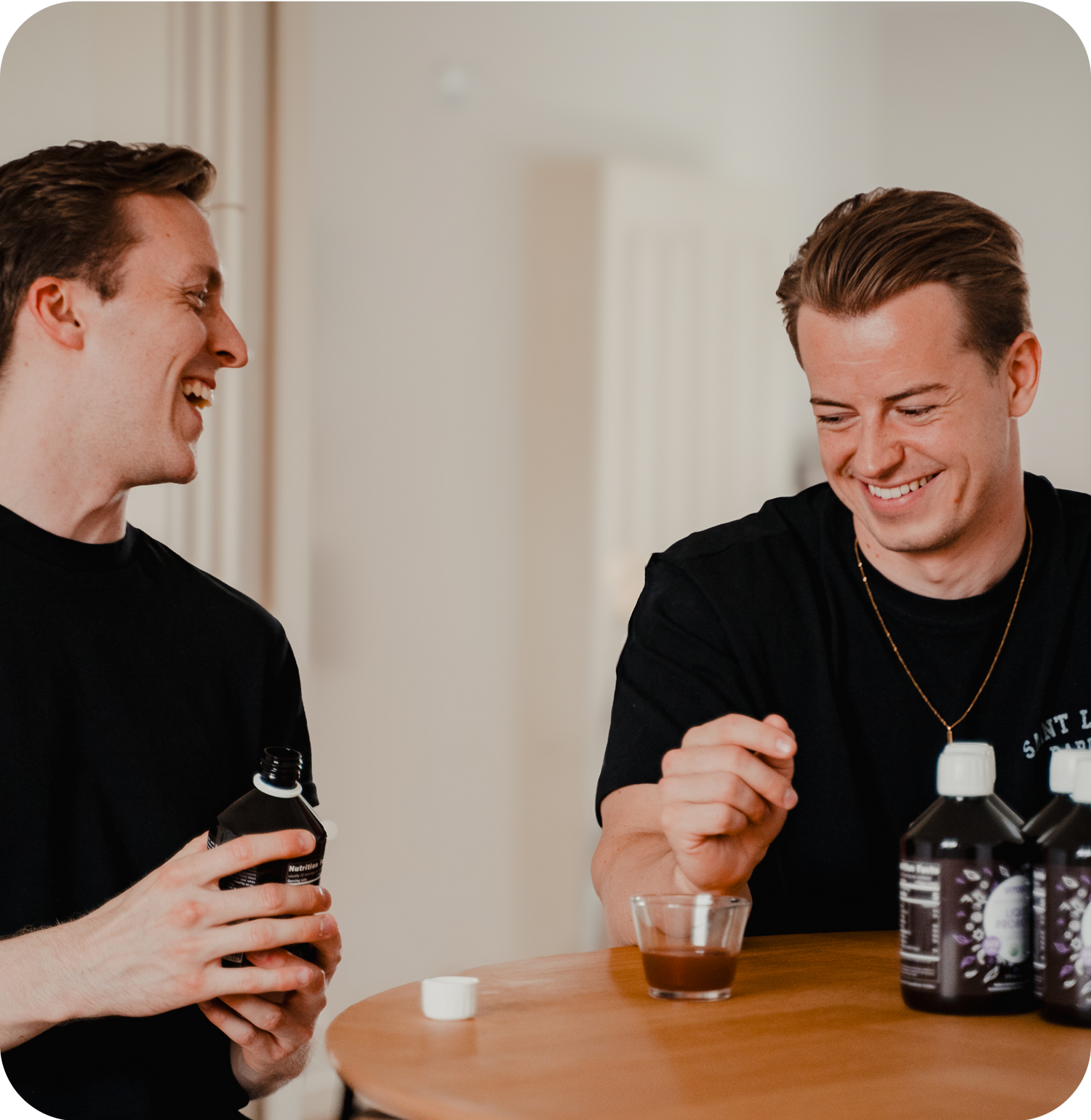 2 persons with a couple of vitagut bottles